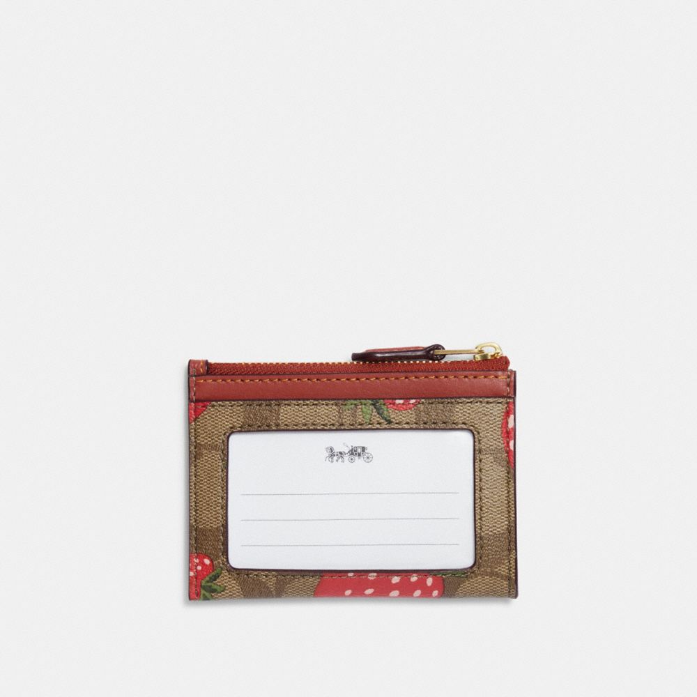 COACH® | Mini Skinny Id Case In Signature Canvas With Wild 