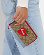 COACH®,MEDIUM ID ZIP WALLET IN SIGNATURE CANVAS WITH WILD STRAWBERRY,Mini,Silver/Khaki/Electric Red,Detail View