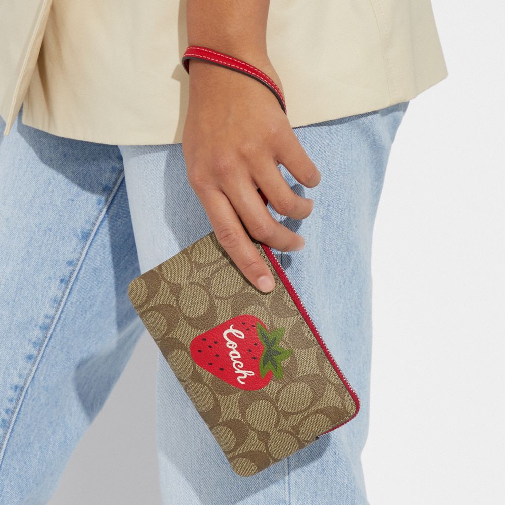 COACH®,CORNER ZIP WRISTLET IN SIGNATURE CANVAS WITH WILD STRAWBERRY,Mini,Silver/Khaki/Electric Red,Detail View