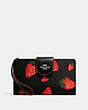 COACH®,PHONE WALLET WITH WILD STRAWBERRY PRINT,Leather,Silver/Black Multi,Front View