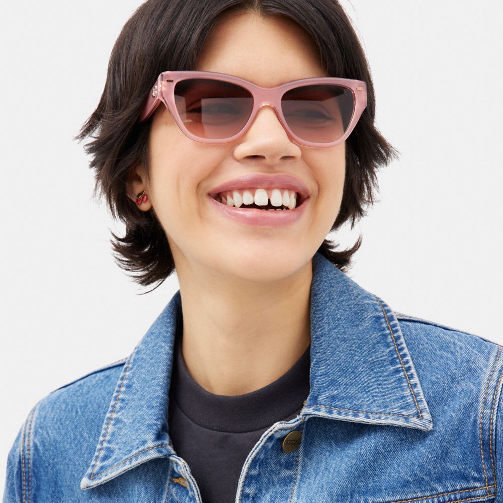 COACH®,BEVELED SIGNATURE SQUARE CAT EYE SUNGLASSES,Transparent Pink,Angle View