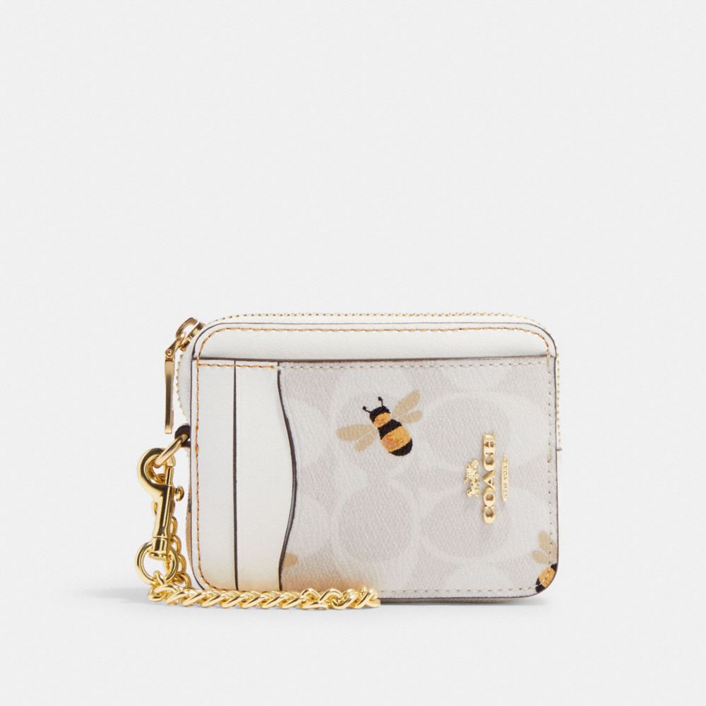 COACH® | Zip Card Case In Signature Canvas With Bee Print