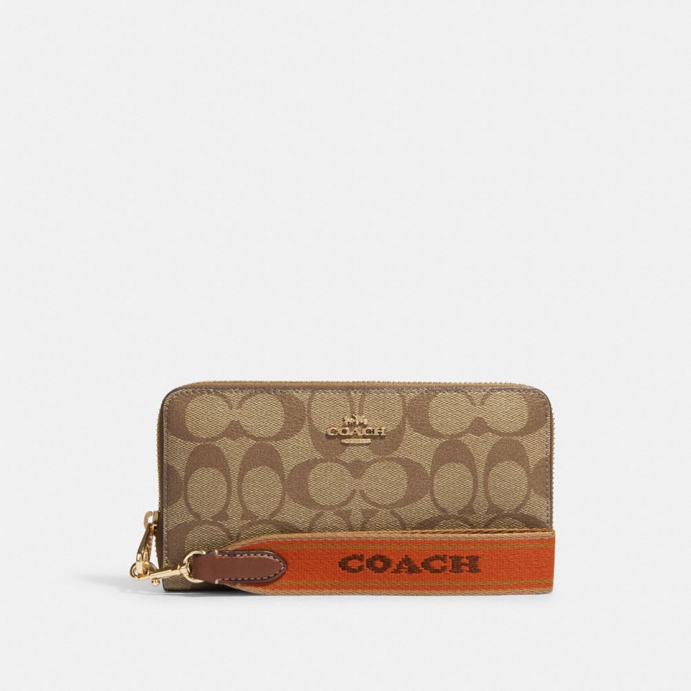 COACH®  Long Zip Around Wallet In Signature Canvas