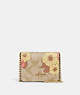 COACH®,MINI WALLET ON A CHAIN IN SIGNATURE CANVAS WITH FLORAL CLUSTER PRINT,Mini,Gold/Light Khaki Multi,Front View