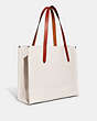 COACH®,RELAY TOTE WITH COACH GRAPHIC,Polished Pebble Leather,X-Large,Chalk Multi,Angle View
