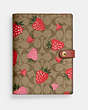 COACH®,NOTEBOOK IN SIGNATURE CANVAS WITH WILD STRAWBERRY PRINT,Gold/Khaki Multi,Front View