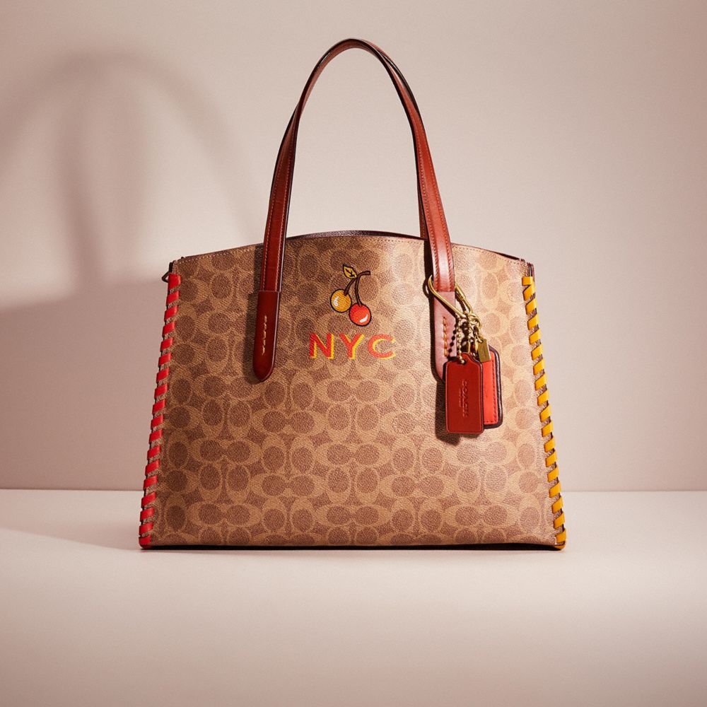 Coach charlie carryall online signature leather