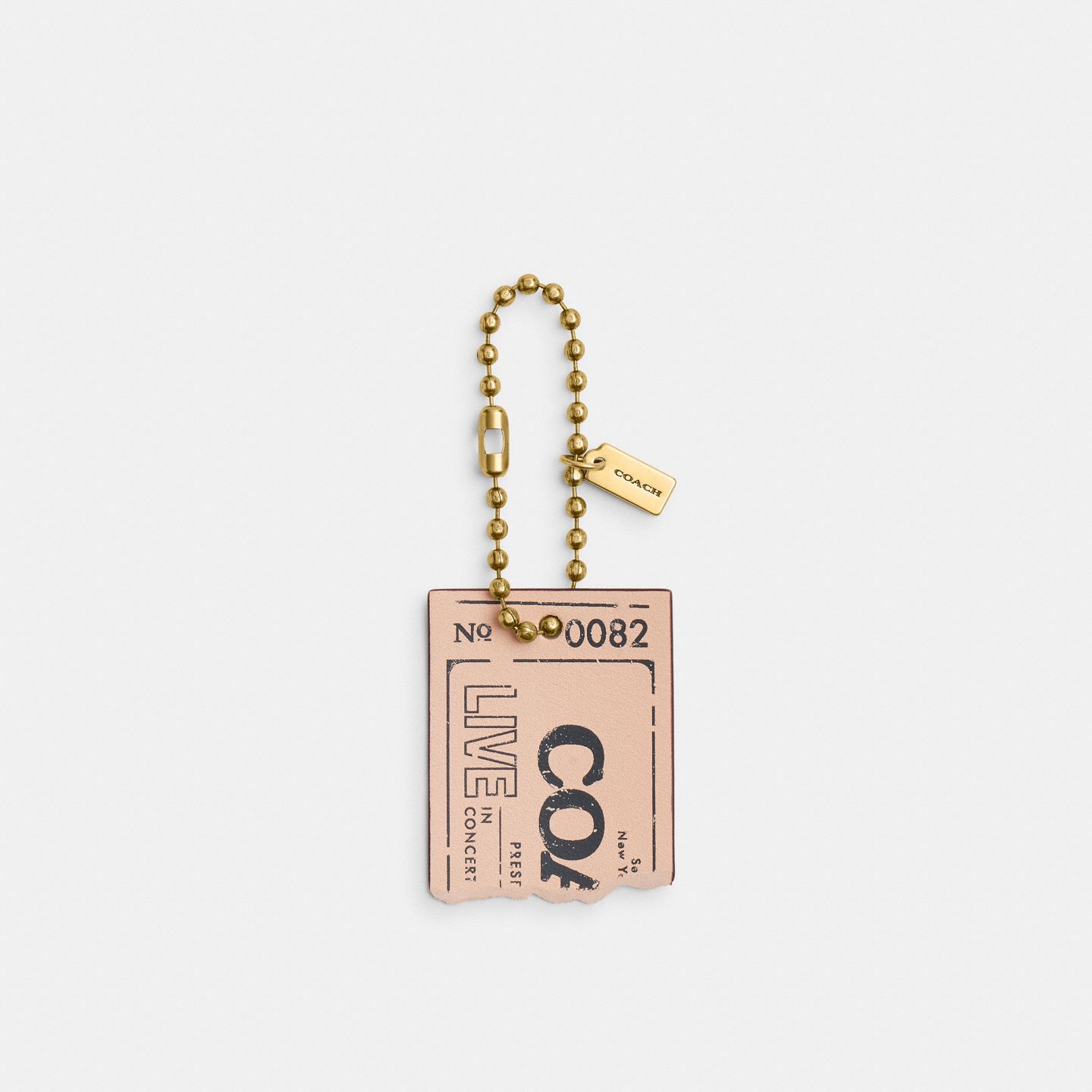 Женский брелок Coach Live In Concert Concert Ticket Bag Charm, цвет: Латунный / Светлый розовый — фото 1