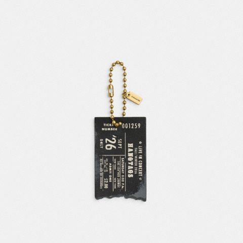 Женский брелок Coach Hangtags Concert Ticket Bag Charm, цвет: Латунный / Чёрный