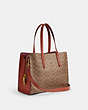 COACH®,CARTER CARRYALL IN SIGNATURE CANVAS,Signature Coated Canvas,Brass/Tan/Rust,Angle View