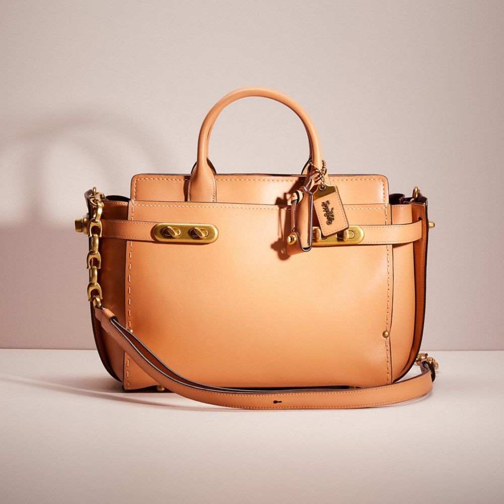 COACH®,RESTORED DOUBLE SWAGGER,Glovetanned Leather,Large,Brass/Apricot,Front View