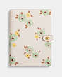 COACH®,NOTEBOOK WITH FLORAL PRINT,Glovetanned Leather,Brass/Chalk Floral,Front View