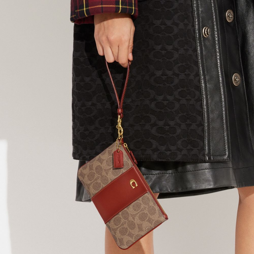 COACH®: Small Wristlet In Signature Canvas