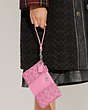 COACH®,SMALL WRISTLET IN SIGNATURE CANVAS,Signature Coated Canvas,Mini,Silver/Vivid Pink,Detail View