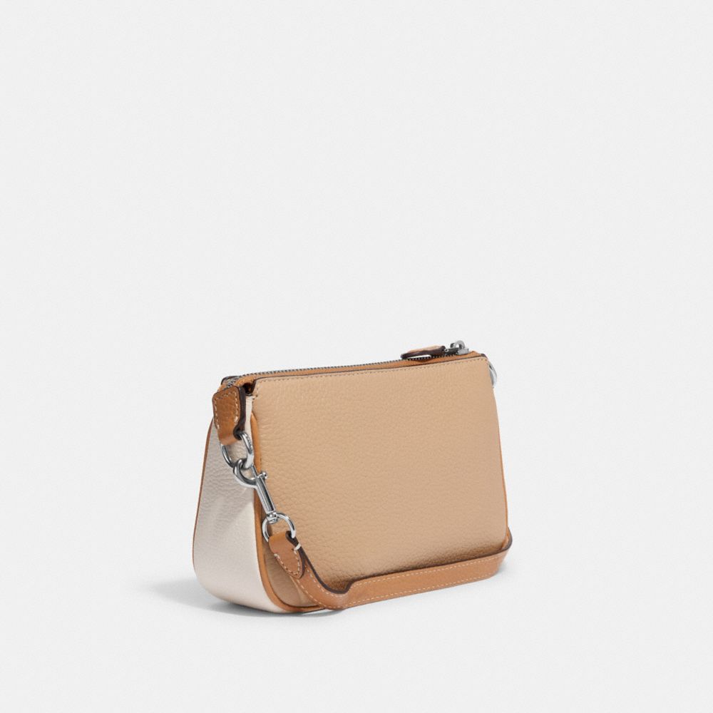 COACH Nolita Wristlet 19 in Polished Pebble Leather