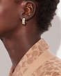 COACH®,SIGNATURE ENAMEL HUGGIE EARRINGS,Gold/White,Detail View