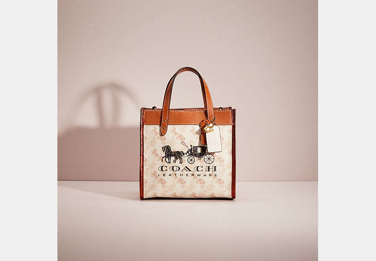 COACH®,UPCRAFTED FIELD TOTE 22 WITH HORSE AND CARRIAGE PRINT AND CARRIAGE BADGE,Printed Coated Canvas,Medium,Brass/Chalk Burnished Amber,Front View