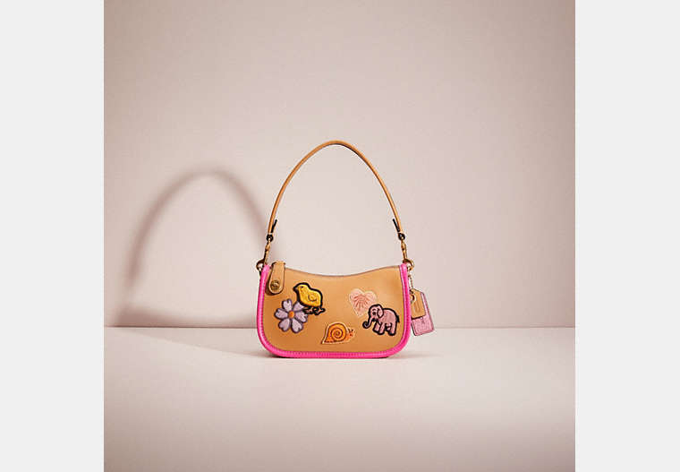 COACH®,UPCRAFTED SWINGER 20 WITH CREATURE PATCHES,Glovetanned Leather,Mini,Brass/Light Tan Multi,Front View