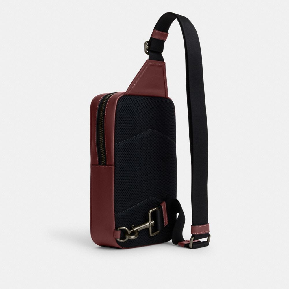 COACH®,SULLIVAN PACK IN SIGNATURE LEATHER,Smooth Leather,Medium,Gunmetal/Wine Multi,Angle View