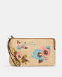 COACH®,LARGE CORNER ZIP WRISTLET WITH FLORAL EMBROIDERY,Straw,Mini,Silver/Natural Multi,Front View