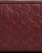 COACH®,LARGE TRAVEL KIT IN SIGNATURE LEATHER,Leather,Medium,Gunmetal/Wine Multi