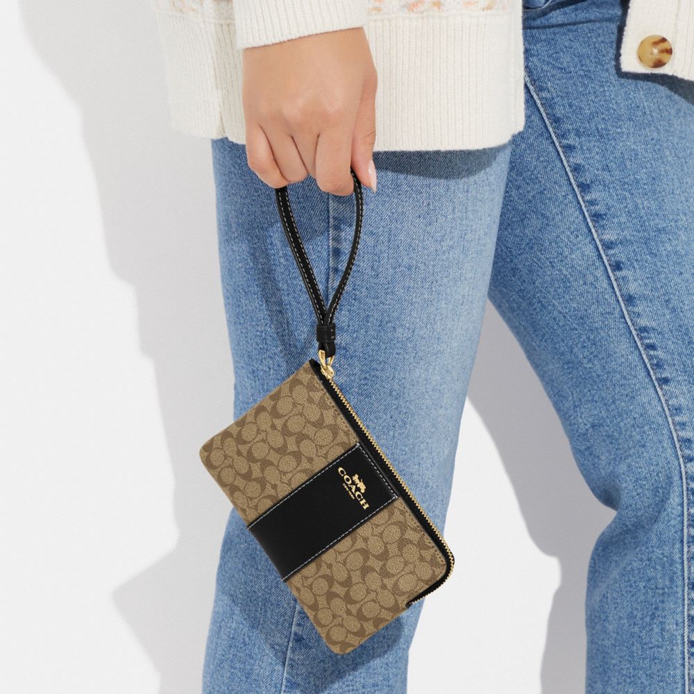 COACH®,CORNER ZIP WRISTLET IN SIGNATURE CANVAS,Signature Canvas,Gold/Khaki/Black,Detail View