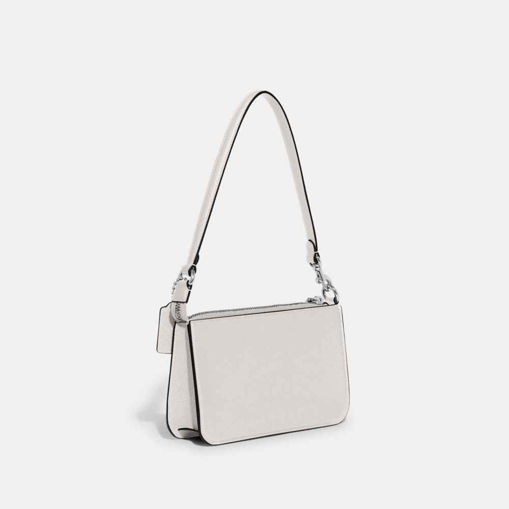 COACH®,POUCH BAG WITH SIGNATURE CANVAS,Crossgrain Leather,Mini,Chalk,Angle View
