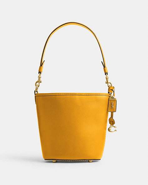 COACH®,DAKOTA BUCKET BAG 16 WITH BRAID,Glovetanned Leather,Medium,Brass/Buttercup,Front View