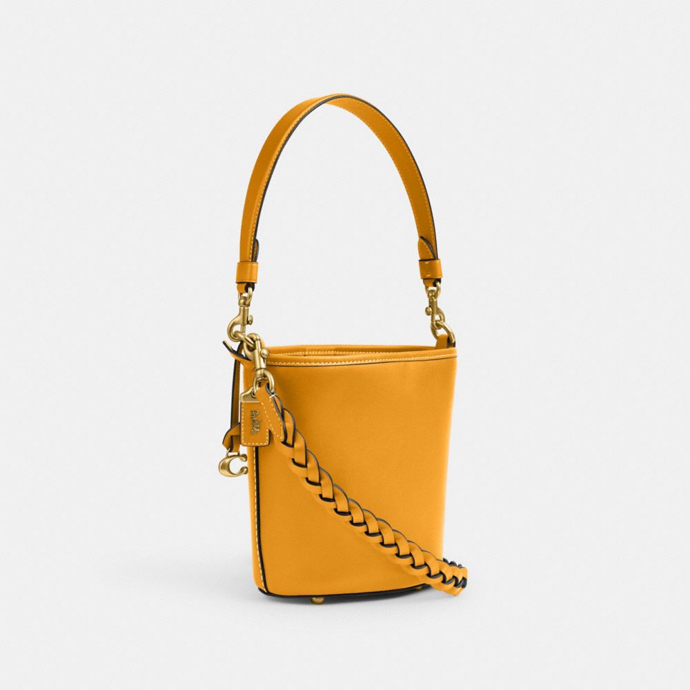 COACH®,DAKOTA BUCKET BAG 16 WITH BRAID,Glovetan Leather,Medium,Brass/Buttercup,Angle View