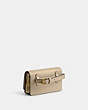 COACH®,BANDIT BELT BAG,Luxe Refined Calf Leather,Mini,Brass/Ivory,Angle View
