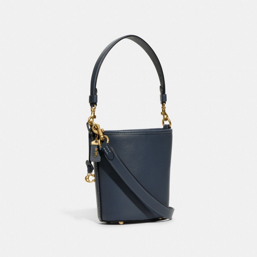 COACH®,DAKOTA BUCKET BAG 16,Glovetan Leather,Medium,Brass/Denim,Angle View