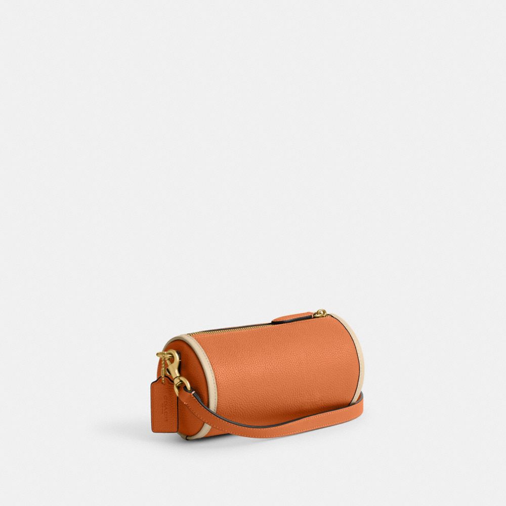 COACH®,ORION BARREL BAG,Refined Pebble Leather,Medium,Brass/Faded Orange,Angle View