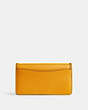 COACH®,TABBY CHAIN CLUTCH WITH BRAID,Polished Pebble Leather,Mini,Brass/Buttercup,Back View