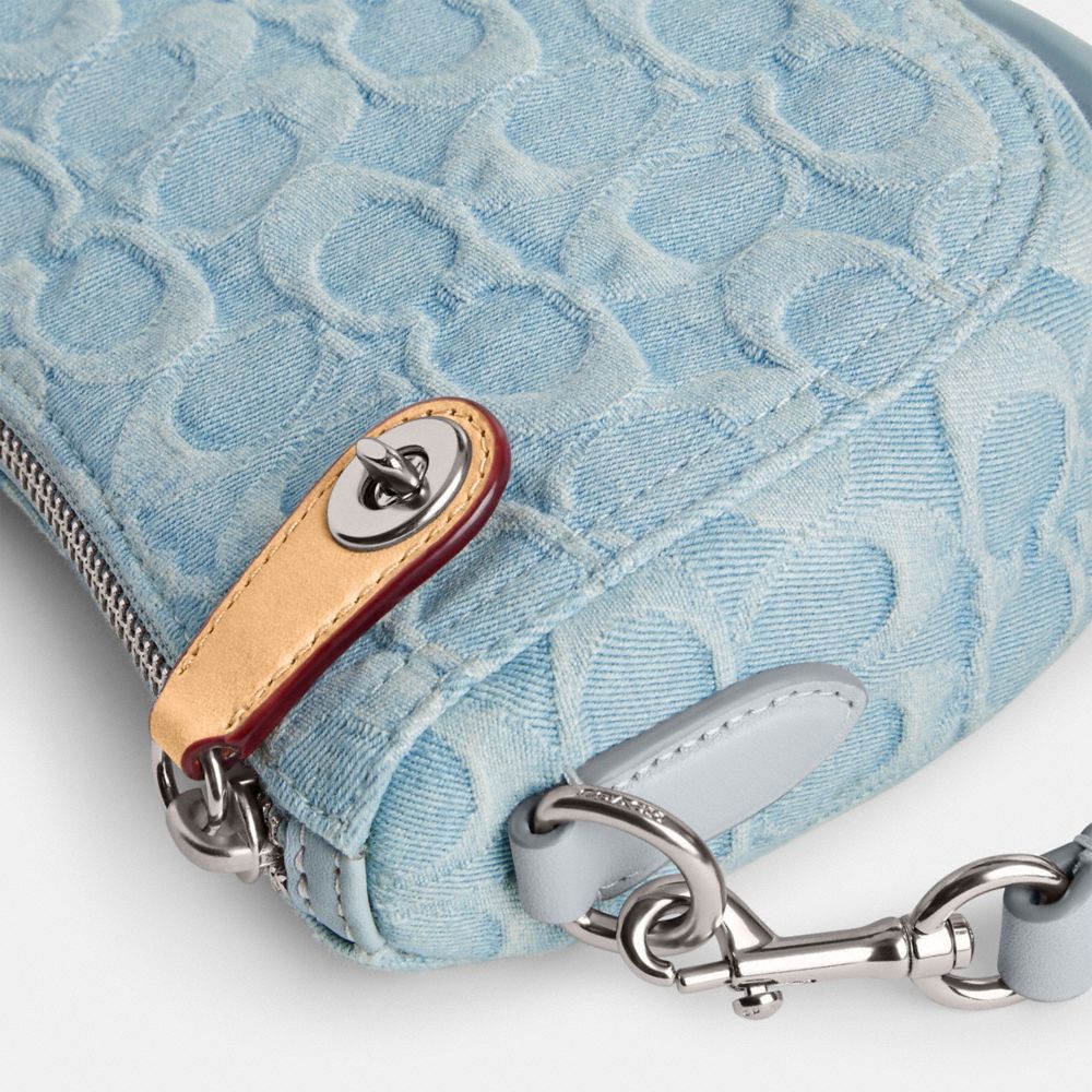 COACH®,Swinger Bag 20 In Signature Denim,,Closer View