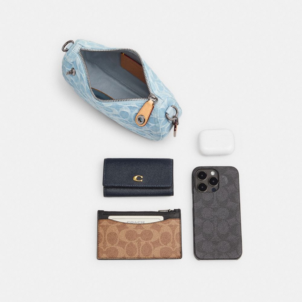 COACH®,Swinger Bag 20 In Signature Denim,,Angle View