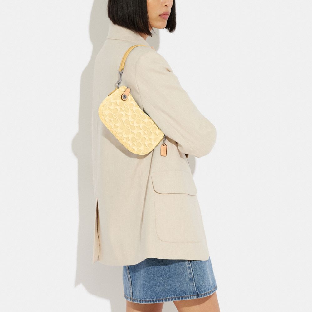 COACH®,Swinger Bag 20 In Signature Denim,,Detail View