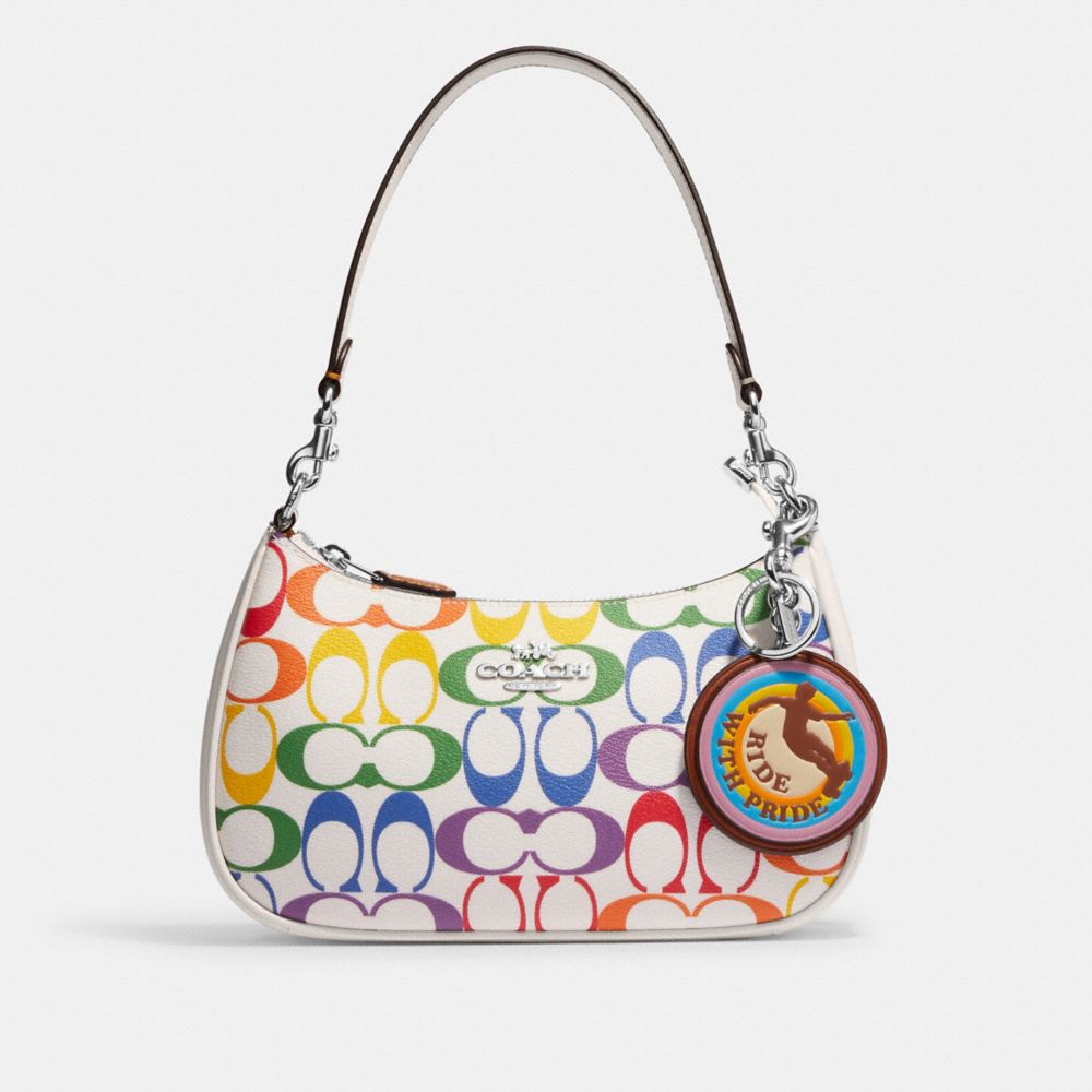 COACH®,RIDE WITH PRIDE BAG CHARM IN RAINBOW SIGNATURE CANVAS,Silver/Chalk Multi,Angle View
