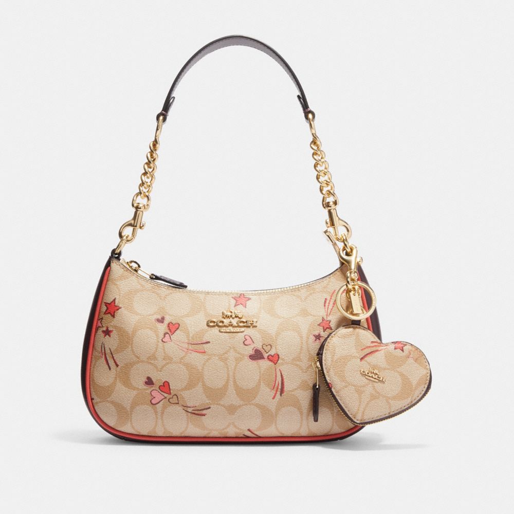 COACH®  Heart Pouch Bag Charm In Signature Canvas With Heart And Star Print