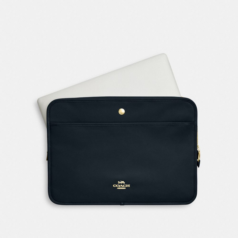 Coach on sale laptop sleeves