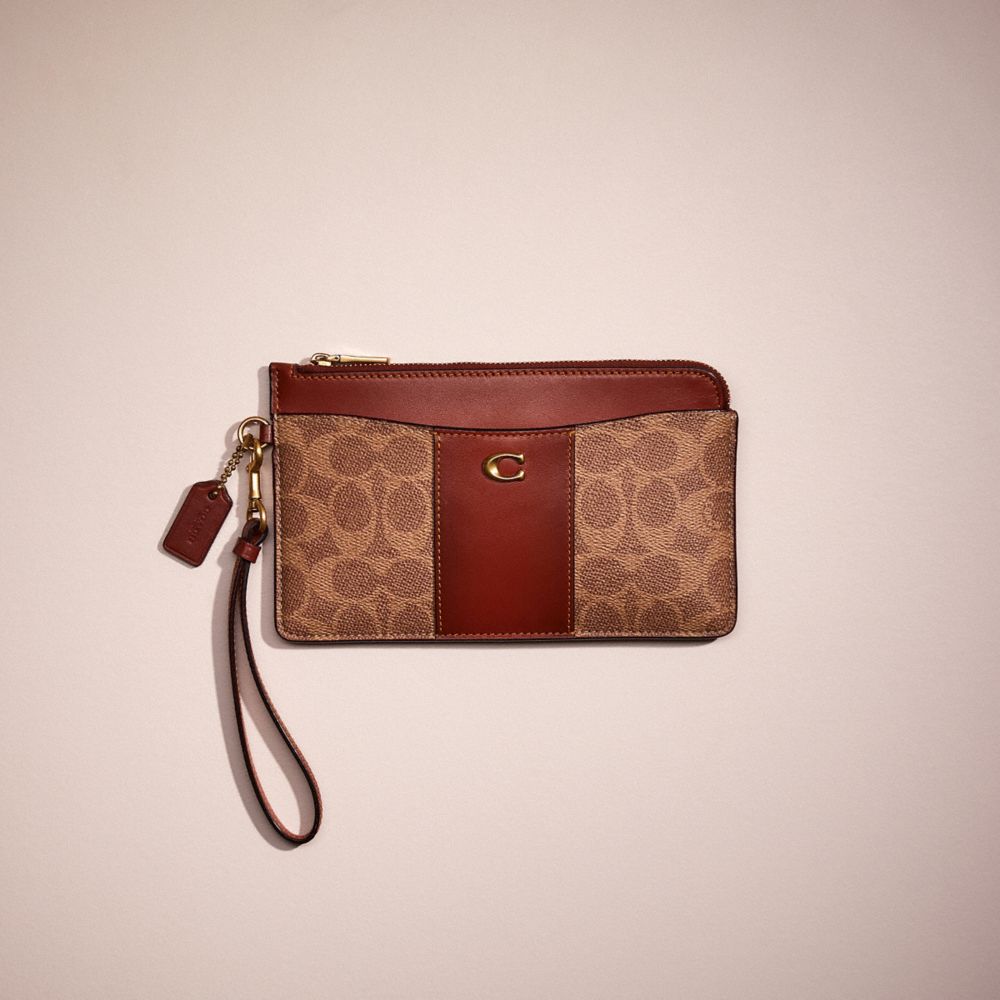 COACH®  L Zip Wristlet In Signature Canvas