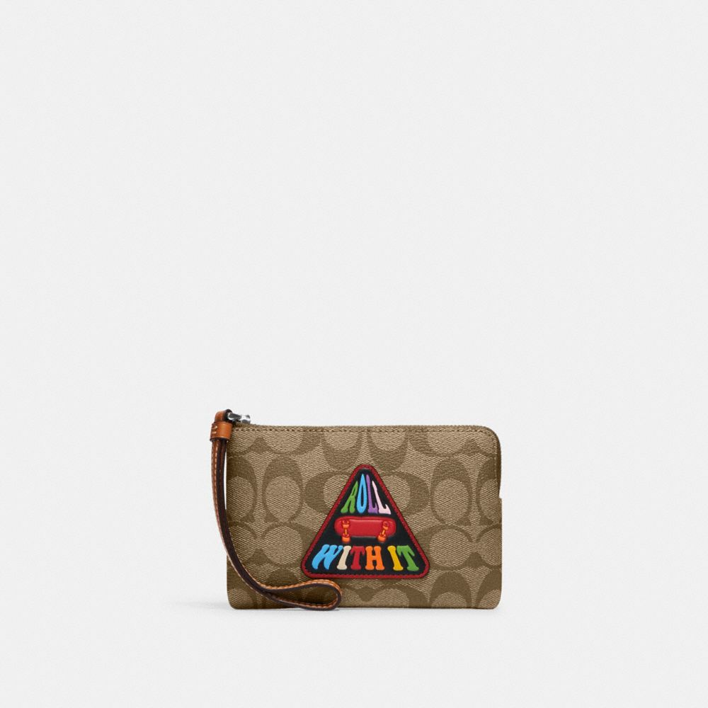 COACH®,CORNER ZIP WRISTLET IN SIGNATURE CANVAS WITH PATCH,Novelty Print,Mini,Silver/Khaki Multi,Front View