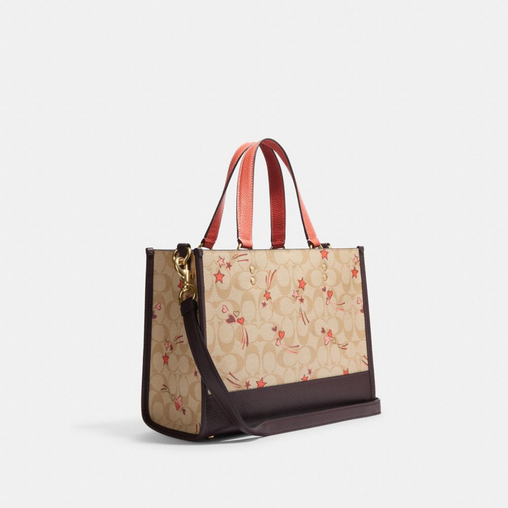 COACH® | Dempsey Carryall In Signature Canvas With Heart And Star