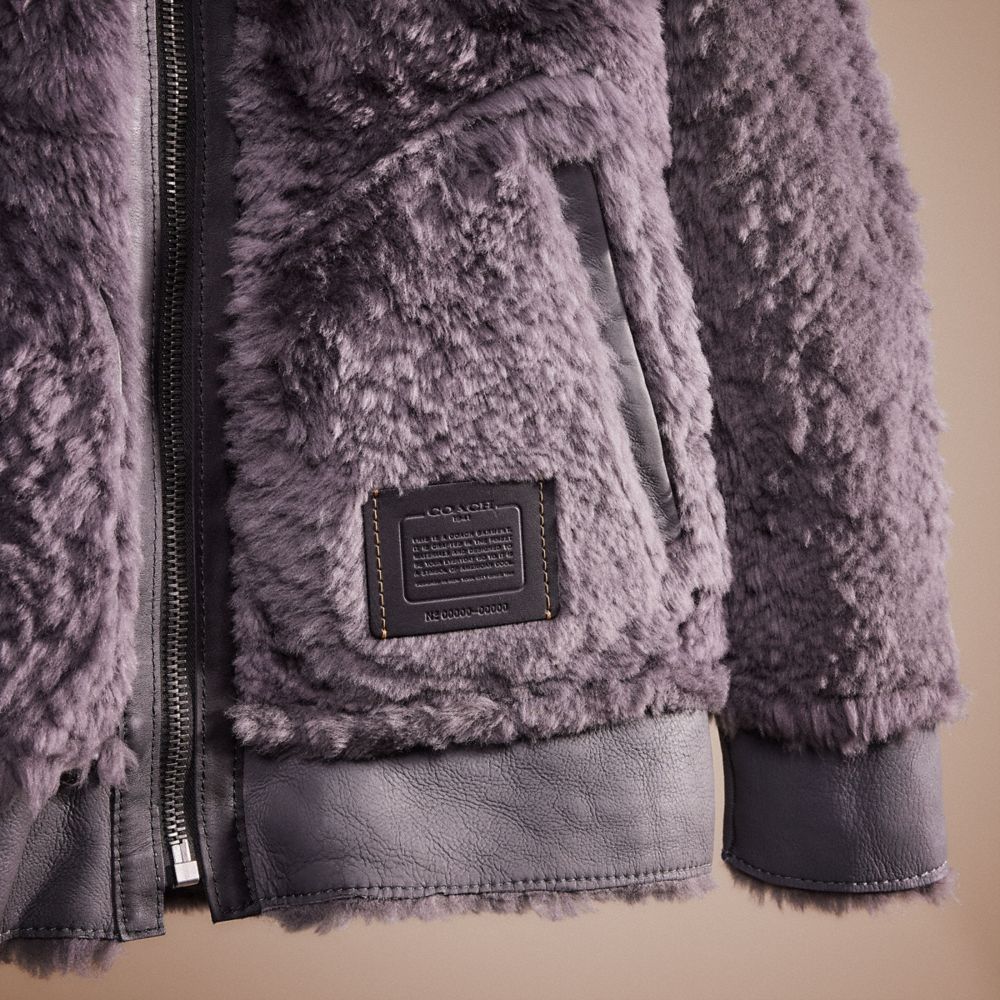 COACH®: Reversible Shearling Hoodie