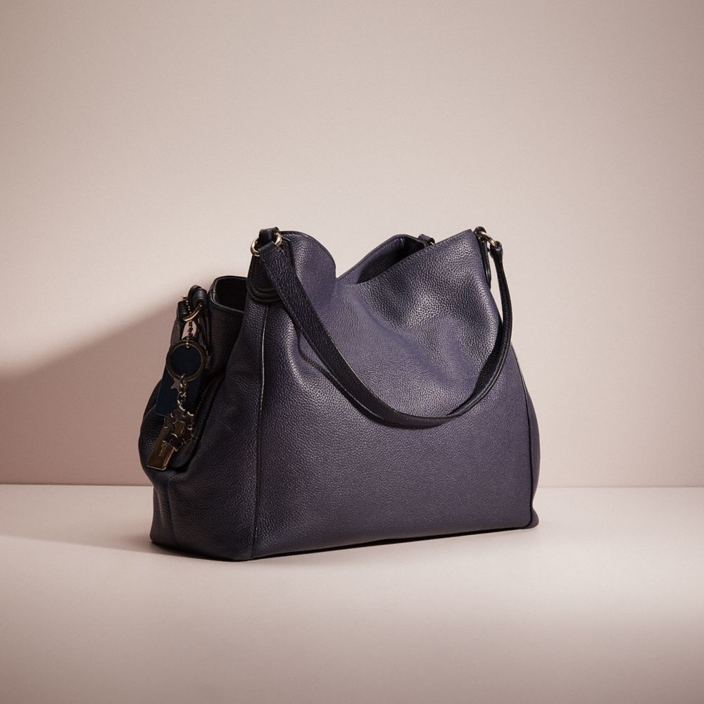 Edie coach bag store on sale