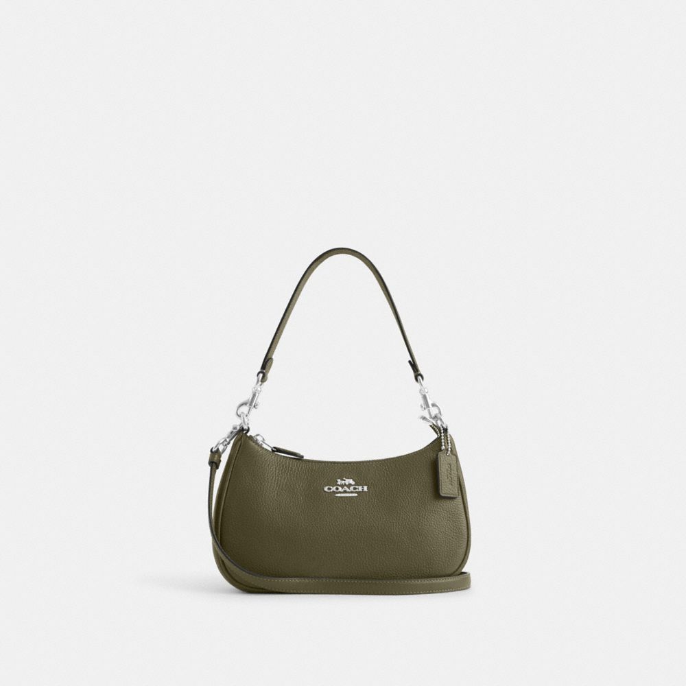 Small green store coach purse