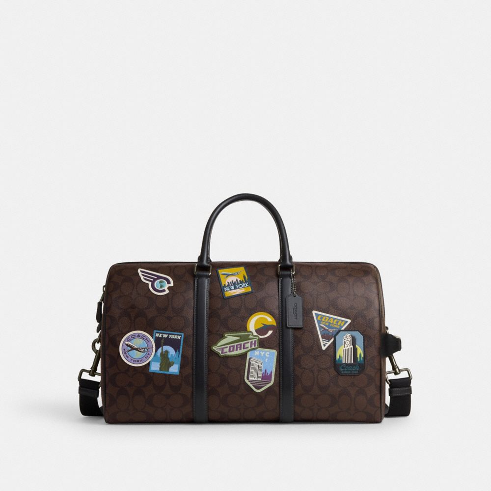 COACH®  Venturer Bag In Signature Canvas With Travel Patches