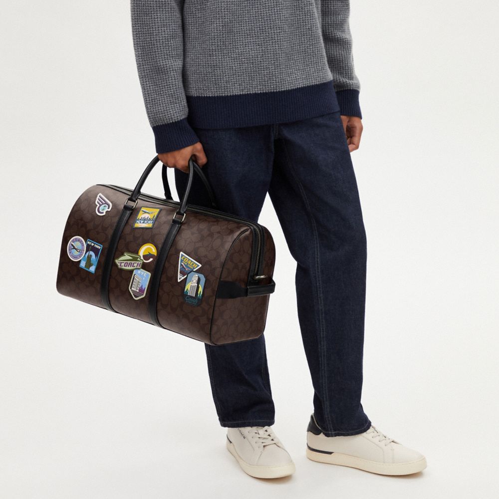 COACH®  Venturer Bag In Signature Canvas With Ski Patches