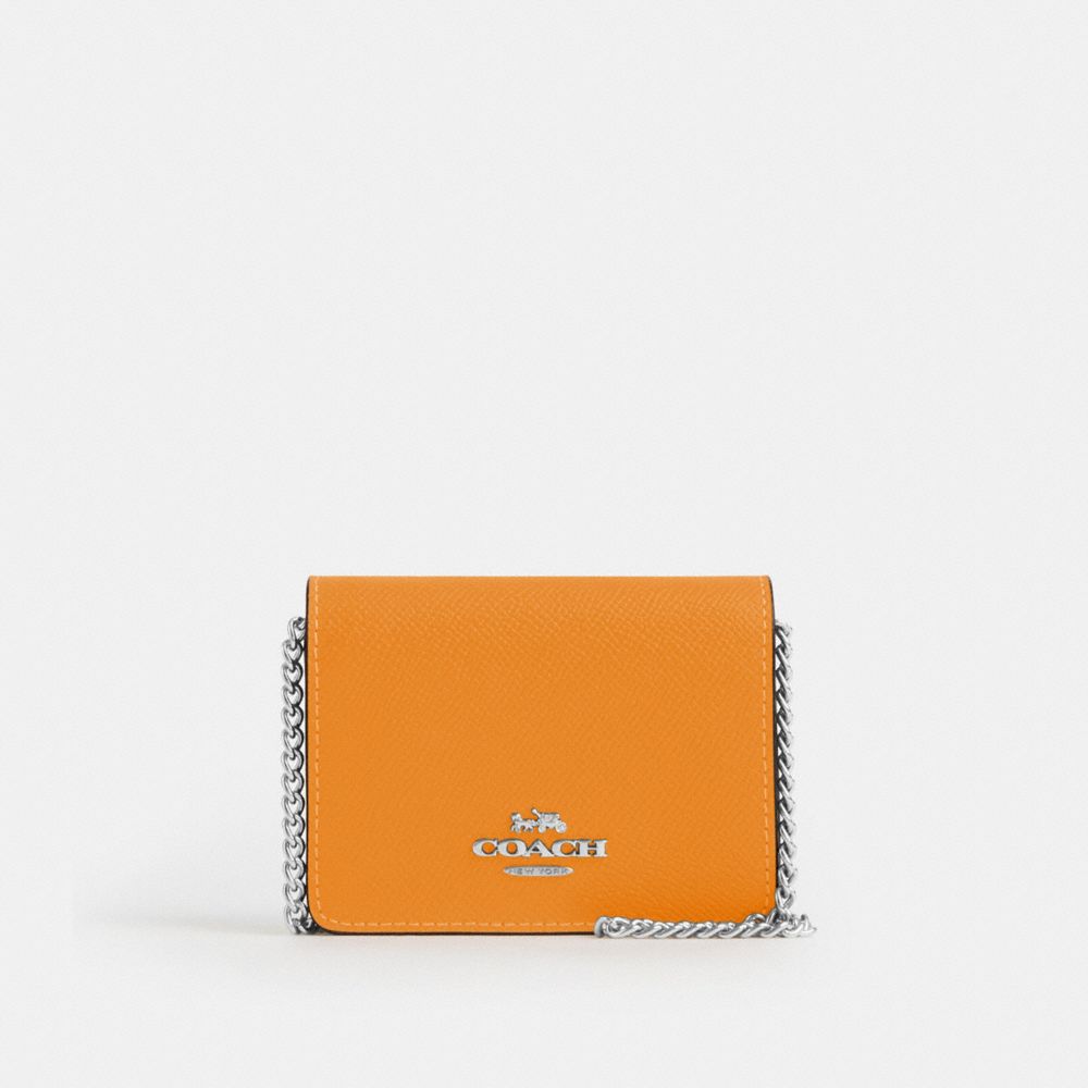 COACH®,MINI WALLET ON A CHAIN IN COLORBLOCK,Novelty Leather,Silver/Bright Yellow Multi,Front View