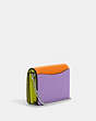 COACH®,MINI WALLET ON A CHAIN IN COLORBLOCK,Leather,Silver/Bright Yellow Multi,Angle View