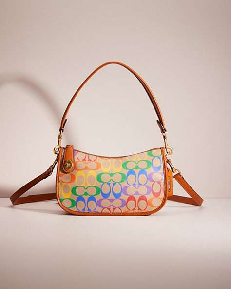 COACH®,RESTORED SWINGER IN RAINBOW SIGNATURE CANVAS,Signature Coated Canvas,Small,Brass/Tan Hazelnut Multi,Front View